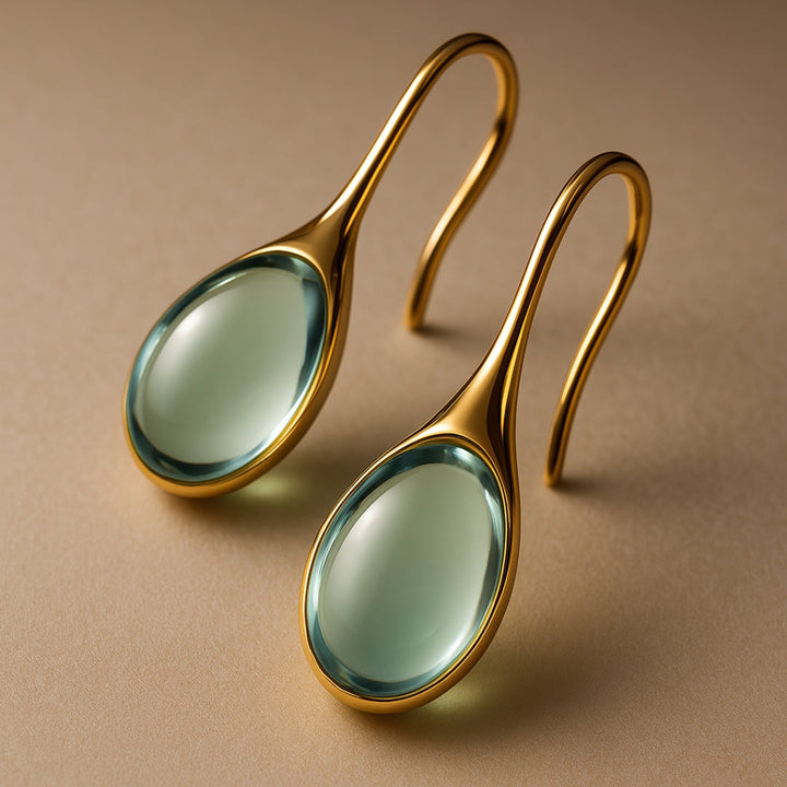 Visiace kryštálové náušnice v zlatej a striebornej 